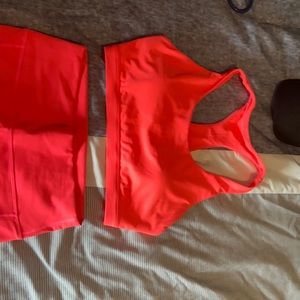 Neon pink fabletics workout outfit